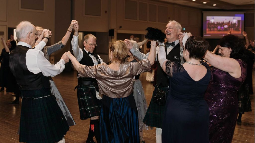 a group of dancersformal wear form a circle and cheer