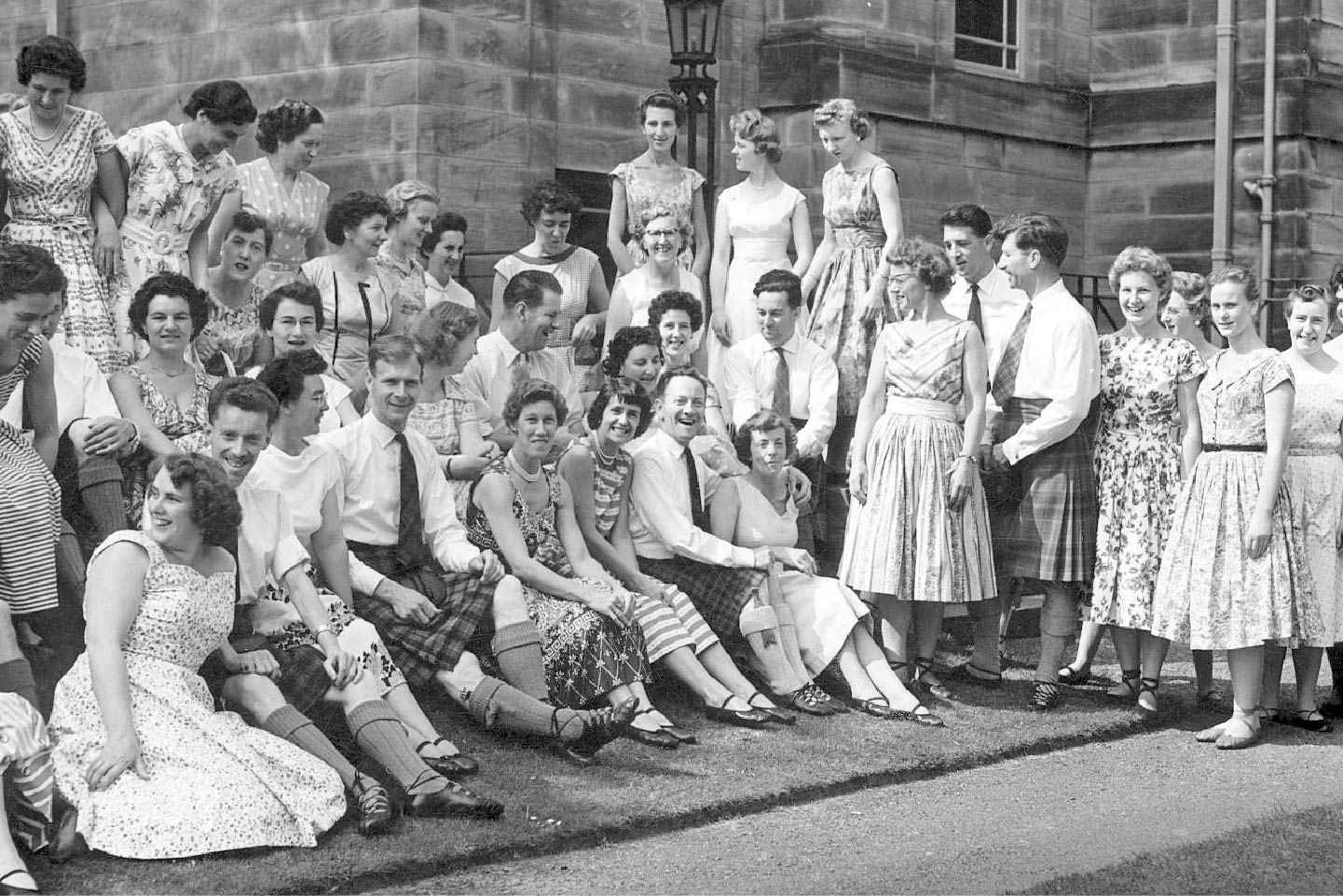 Archive style black and white photo of Royal Scottish Country Dance Society's founder Jean Milligan's class at Summer School St Andrews in 1951